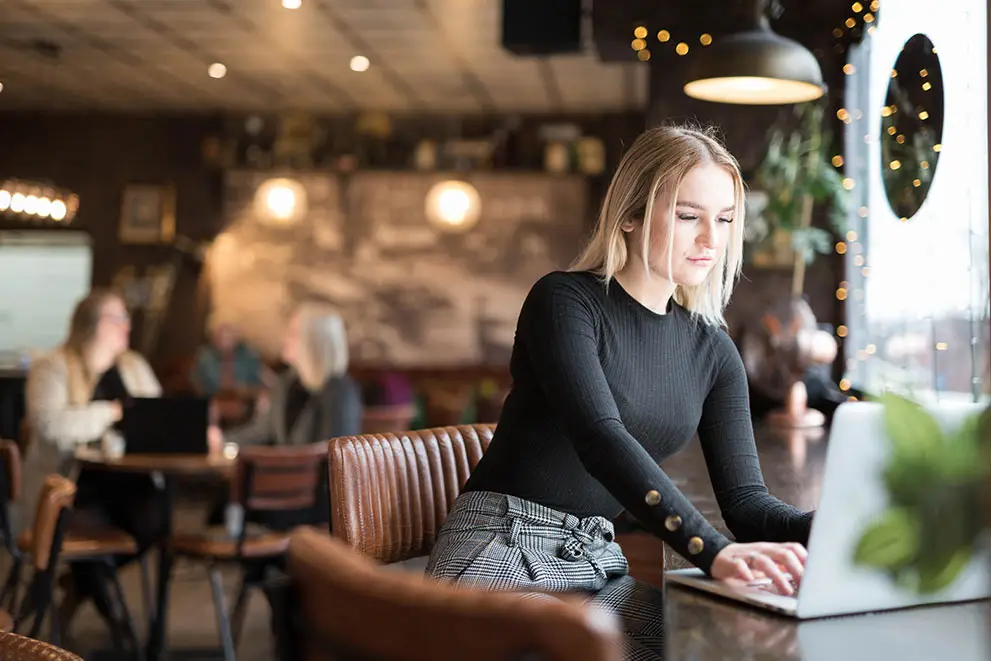 Woman typing on a laptop